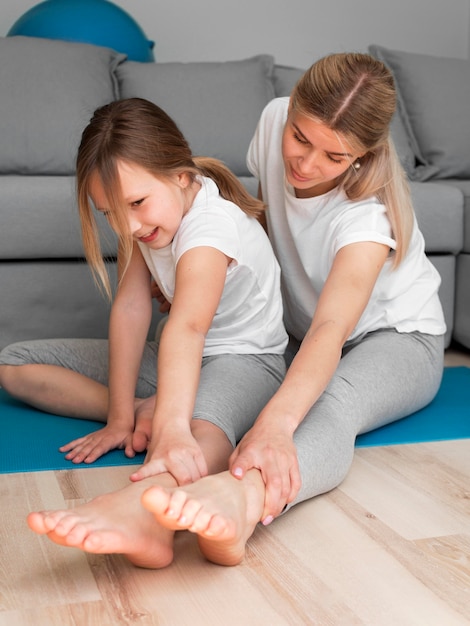 Girl and mom stretching