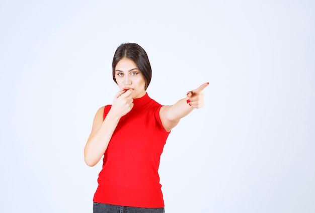 Girl noticing and addressing to a someone ahead.