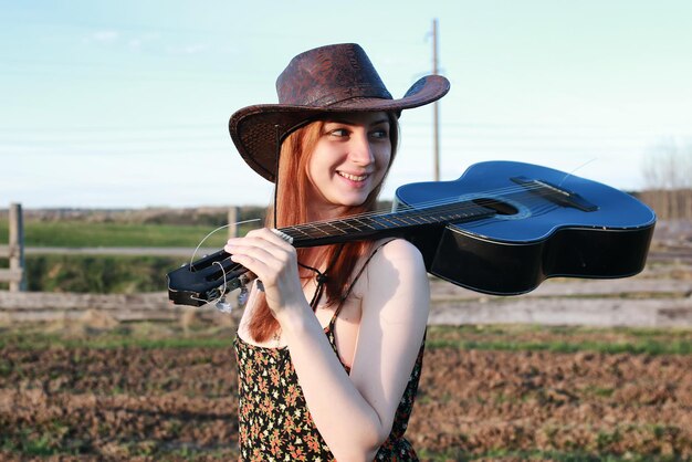 Girl outdoor field sunset texas hat