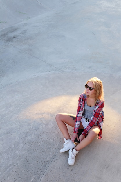 Girl outdoor with a skateboard