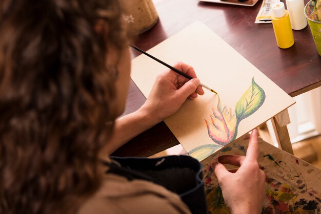 Girl painting a canvas