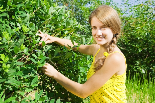 girl picking honeyberry