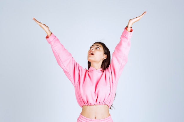 Girl in pink pajamas giving happy and seductive poses