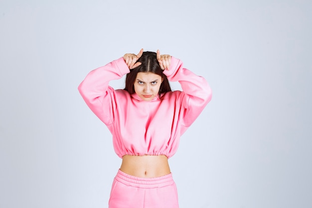 Girl in pink pajamas looks like a fighter and agressive