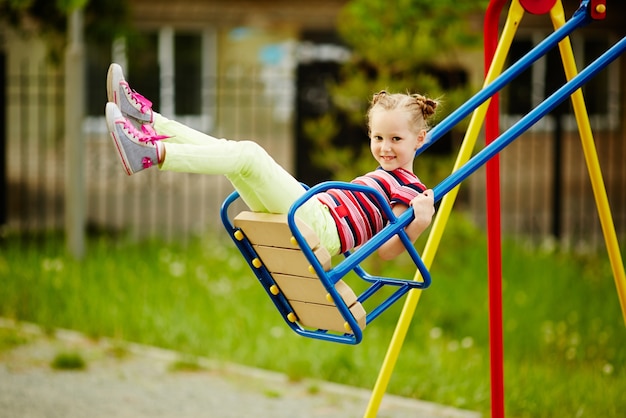 Girl playing alone in the playground