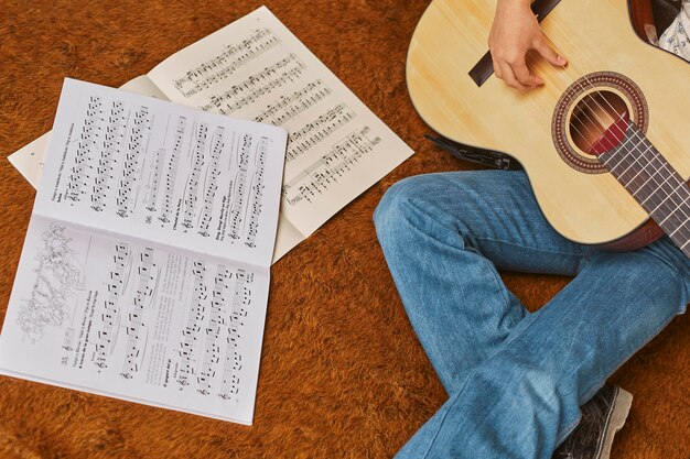 Girl playing guitar at home