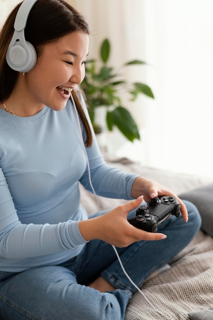 Girl playing videogame with controller