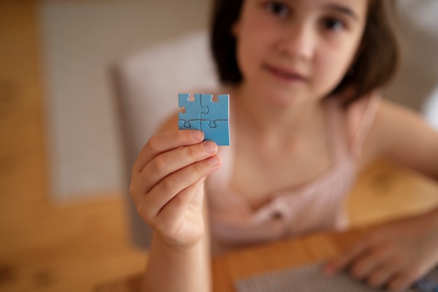 Free photo girl playing with brain teaser toys