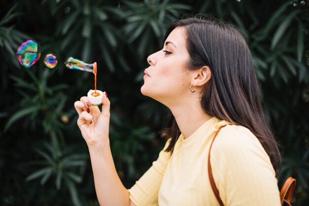 Girl playing with bubbles