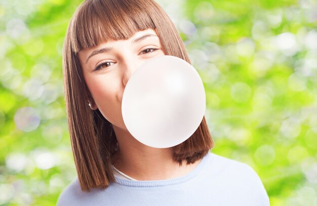 Girl playing with a gum