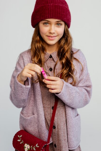 Girl playing with soap bubbles