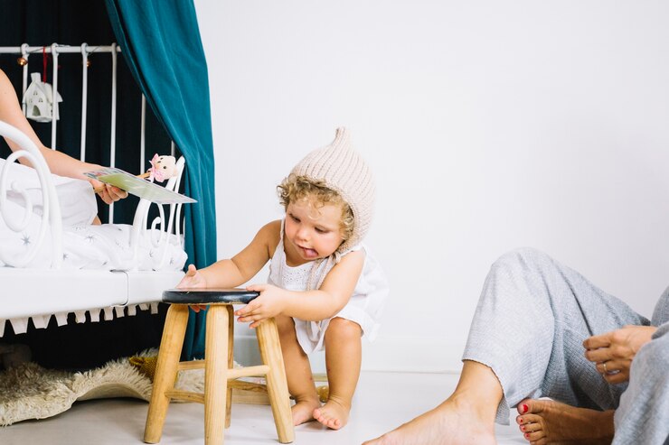 Free Photo girl playing with stool