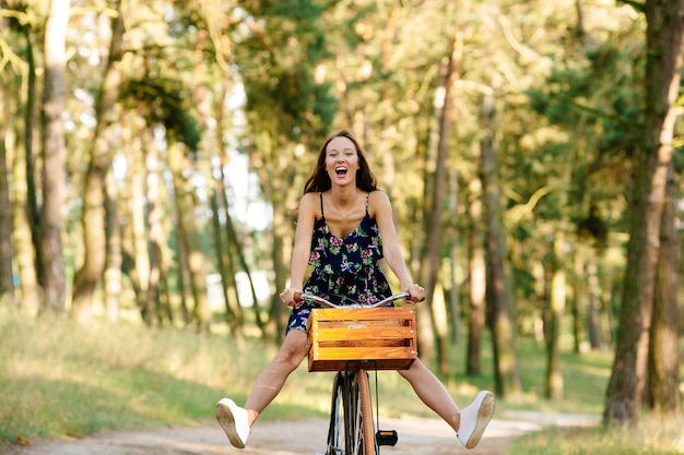 Girl plays the fool on the bike