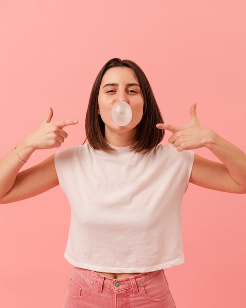 Girl pointing at bubble gum