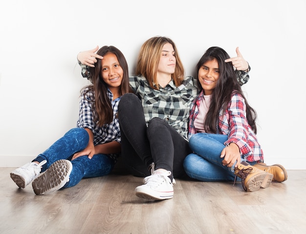 Girl pointing the heads of her friends