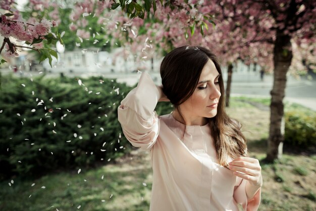 Girl portrait on sakura background