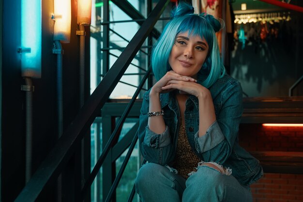 Girl portrait with stylish blue hair and pretty face expression