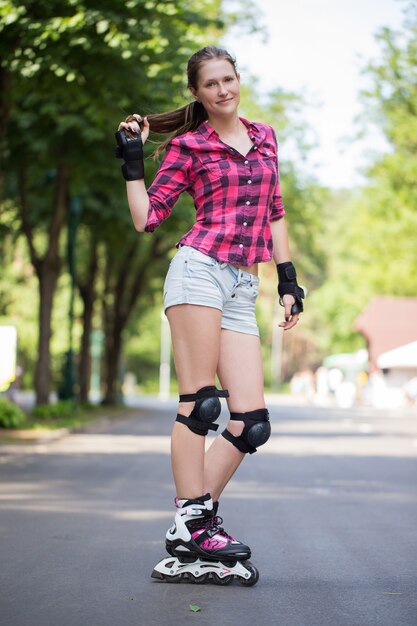 Girl posing in park with her blades on