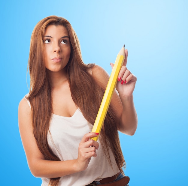 Girl posing with pencil in hands