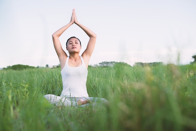 Girl practicing yoga sitting