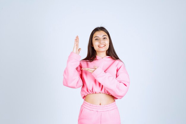 Girl raising her hand and waiting to be noticed