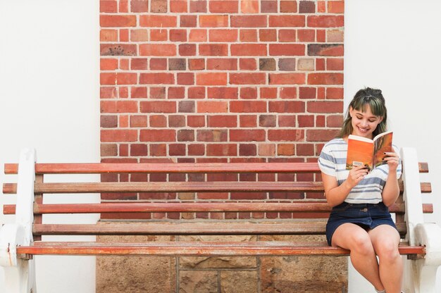 Girl reading on a bench