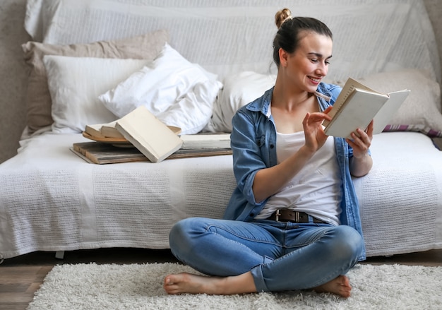 girl reading a book in a cozy room