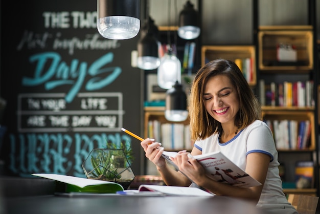 Girl reading book smiling