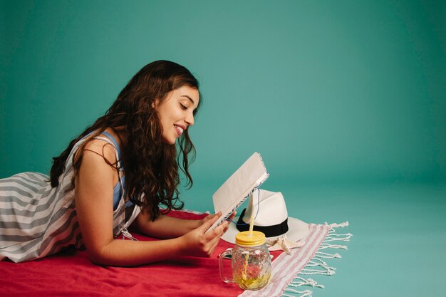 Girl reading on towel