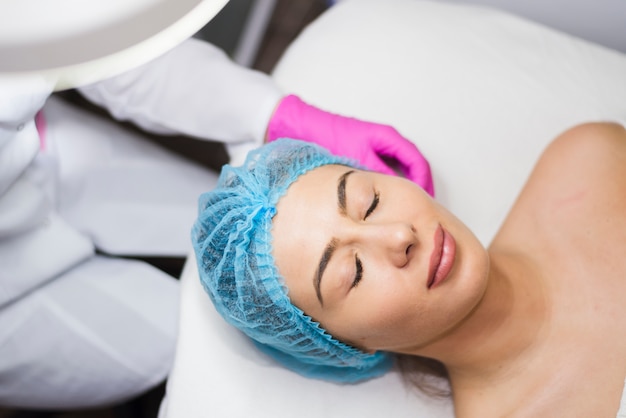 Girl receiving facial treatment in a beauty salon