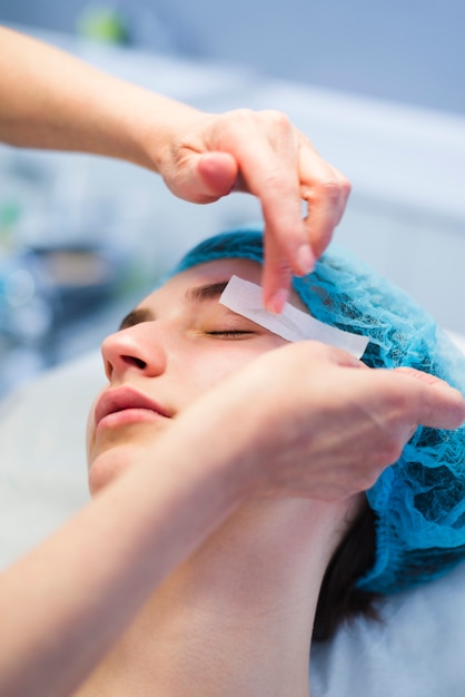 Girl receiving facial treatment in a beauty salon