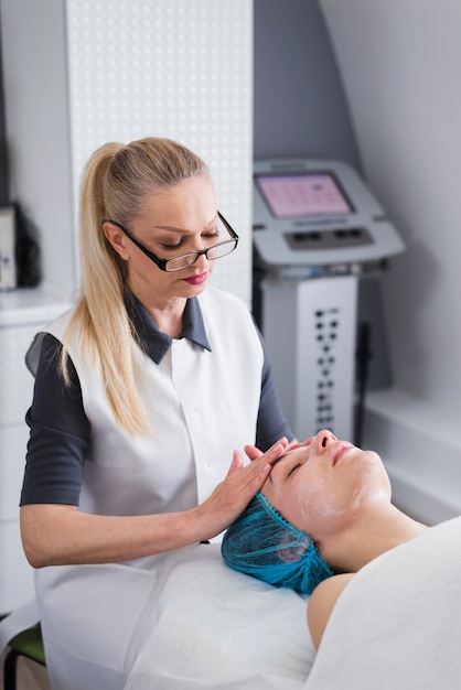 Girl receiving facial treatment in a beauty salon