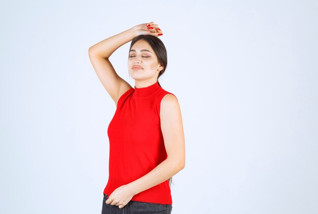 Girl in a red shirt giving positive and seductive poses.