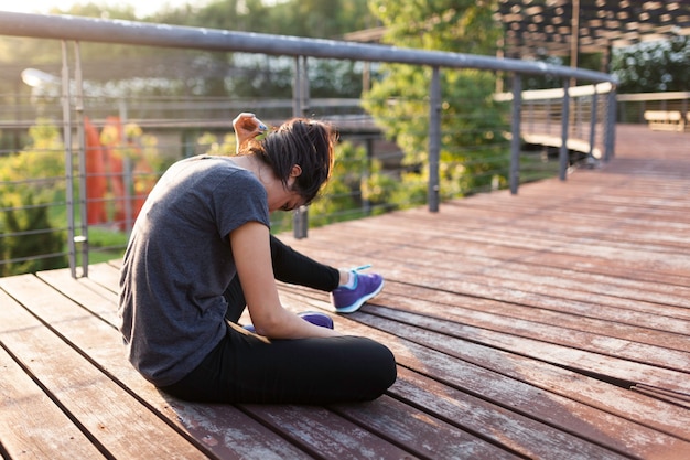 Girl resting on wooden planks