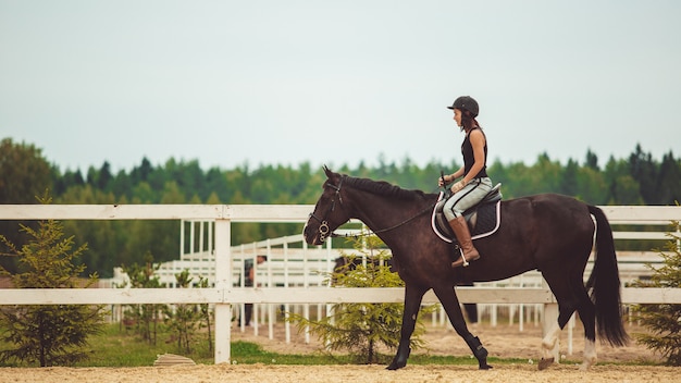 the girl rides a horse