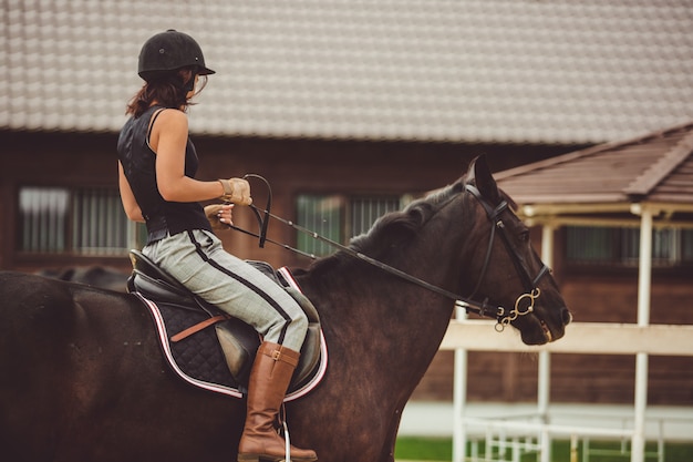 the girl rides a horse