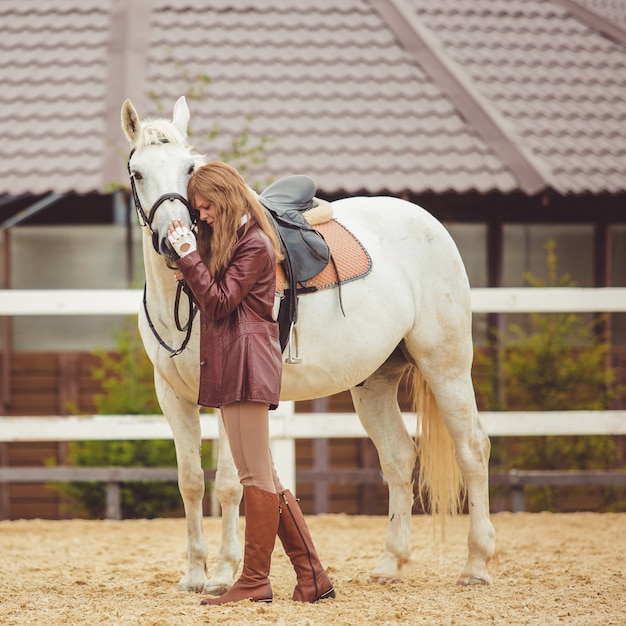 the girl rides a horse