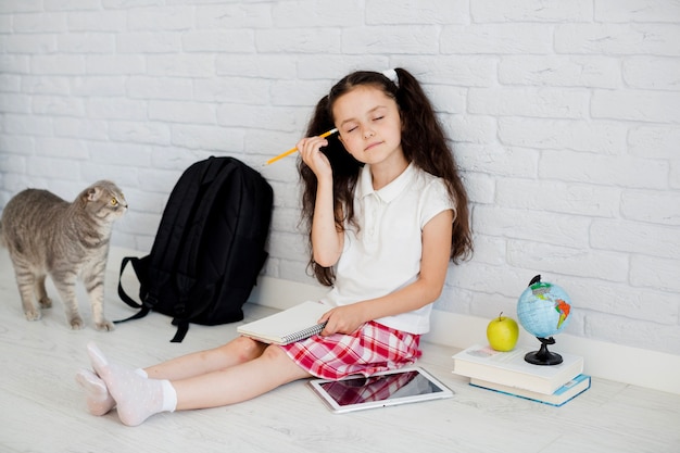 Girl scratching head with eyes closed