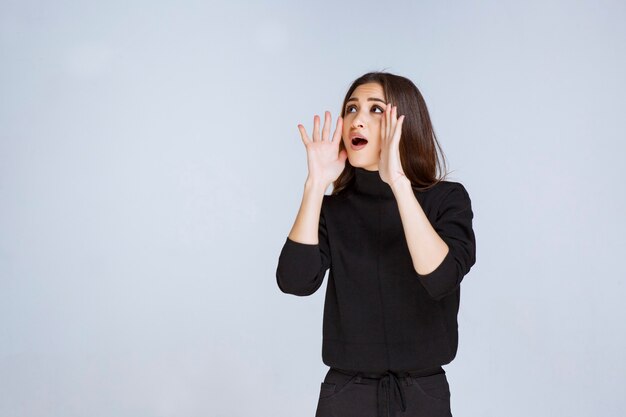 Girl shouting to make herself heard. High quality photo