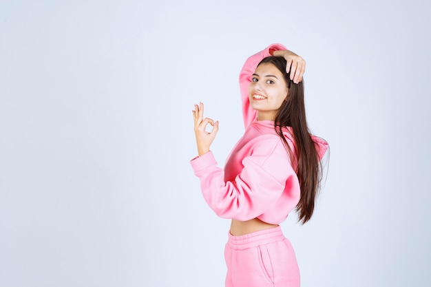 Girl showing enjoyment hand sign