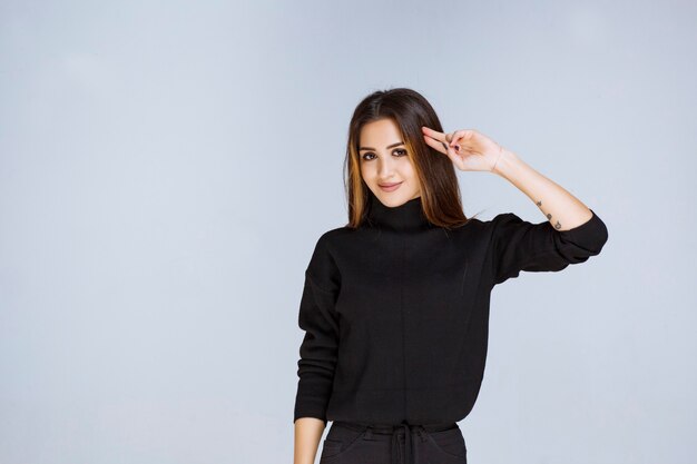 Girl showing gun sign in the hand. High quality photo