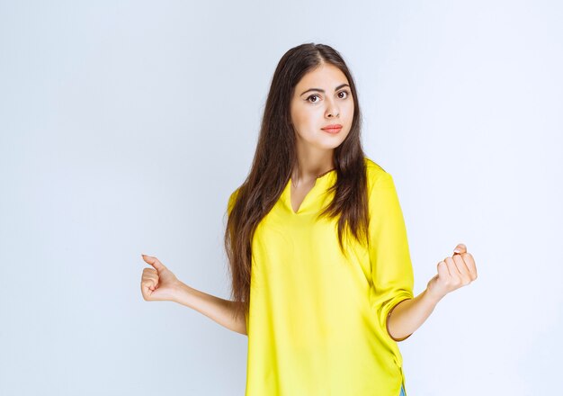 Girl showing her fists and feeling powerful.