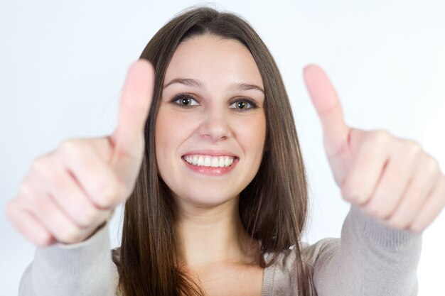 "Girl showing her thumbs up."