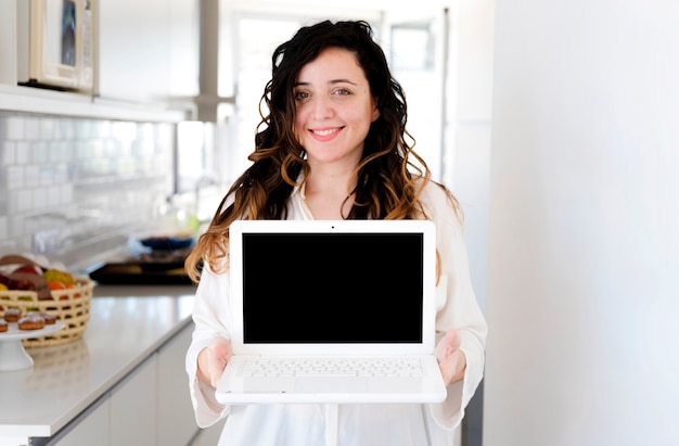 Girl showing laptop