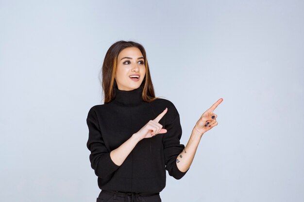 Free Photo Girl showing something on the right side high quality photo Free Photo Girl showing something on the right side high quality photo