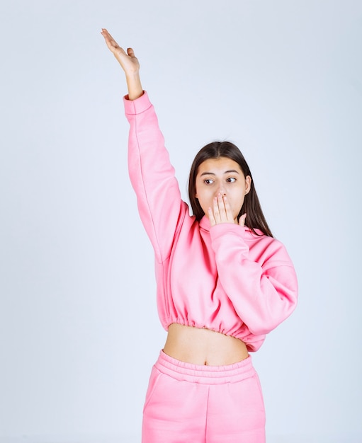 Girl signing to be quiet and keep silence