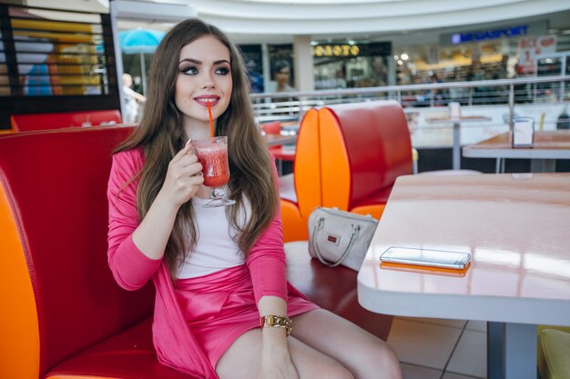 Girl sitting with a drink