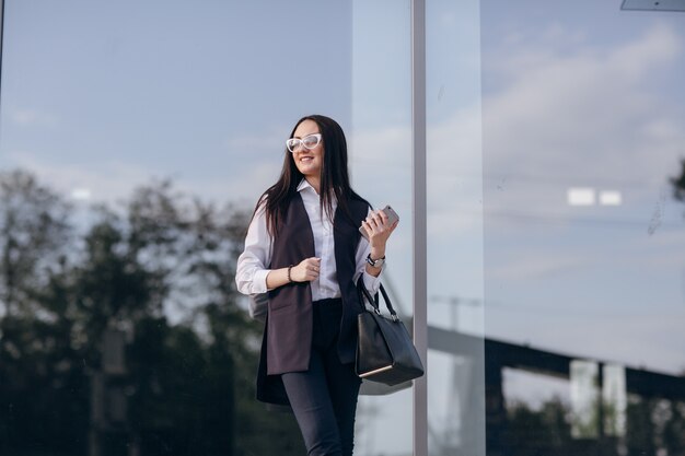 Girl smiling with some windows behind