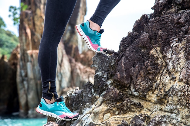 Free photo girl in sportswear on the rocks