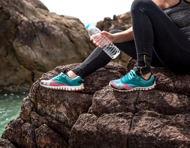 girl in sportswear on the rocks